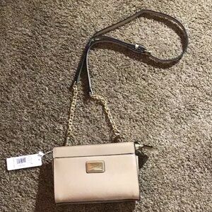 Simply Noelle tan crossbody purse . 
NWT and adjustable strap .